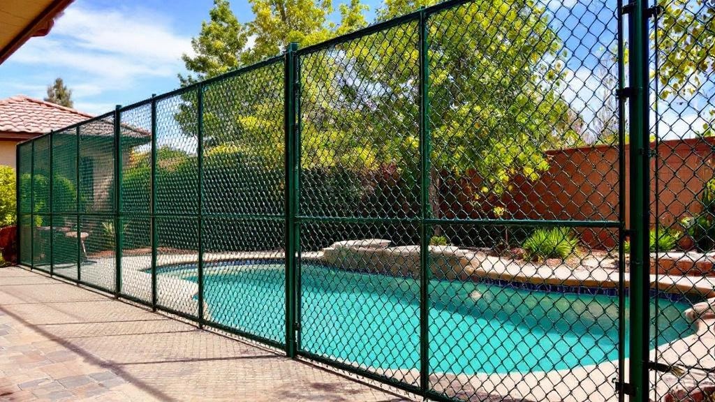 green vinyl-coated chain link fence - 4-foot pool fence installation by professional fence contractor in Denver, Colorado