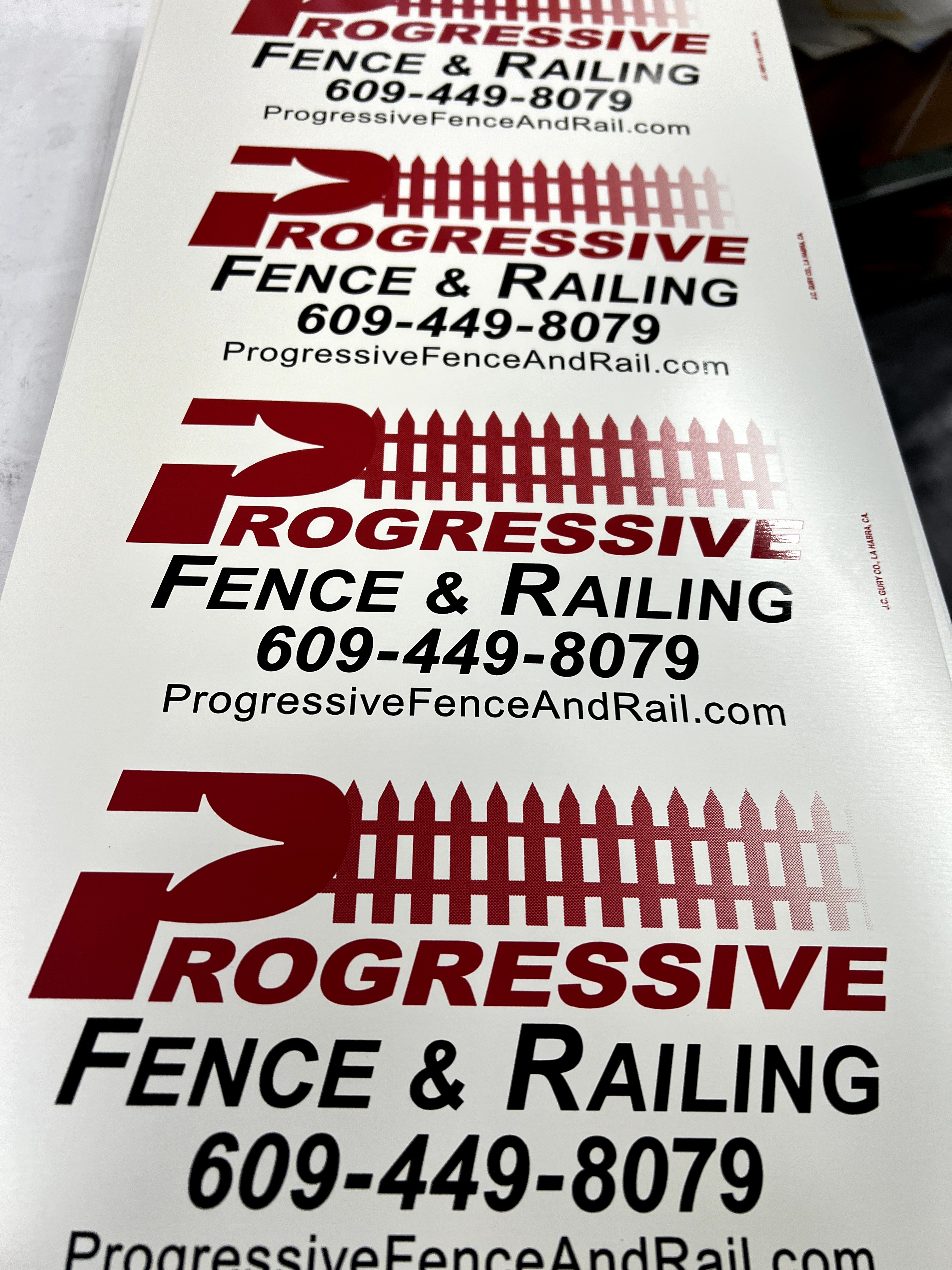 Custom red and black rectangle sign for fence businesses