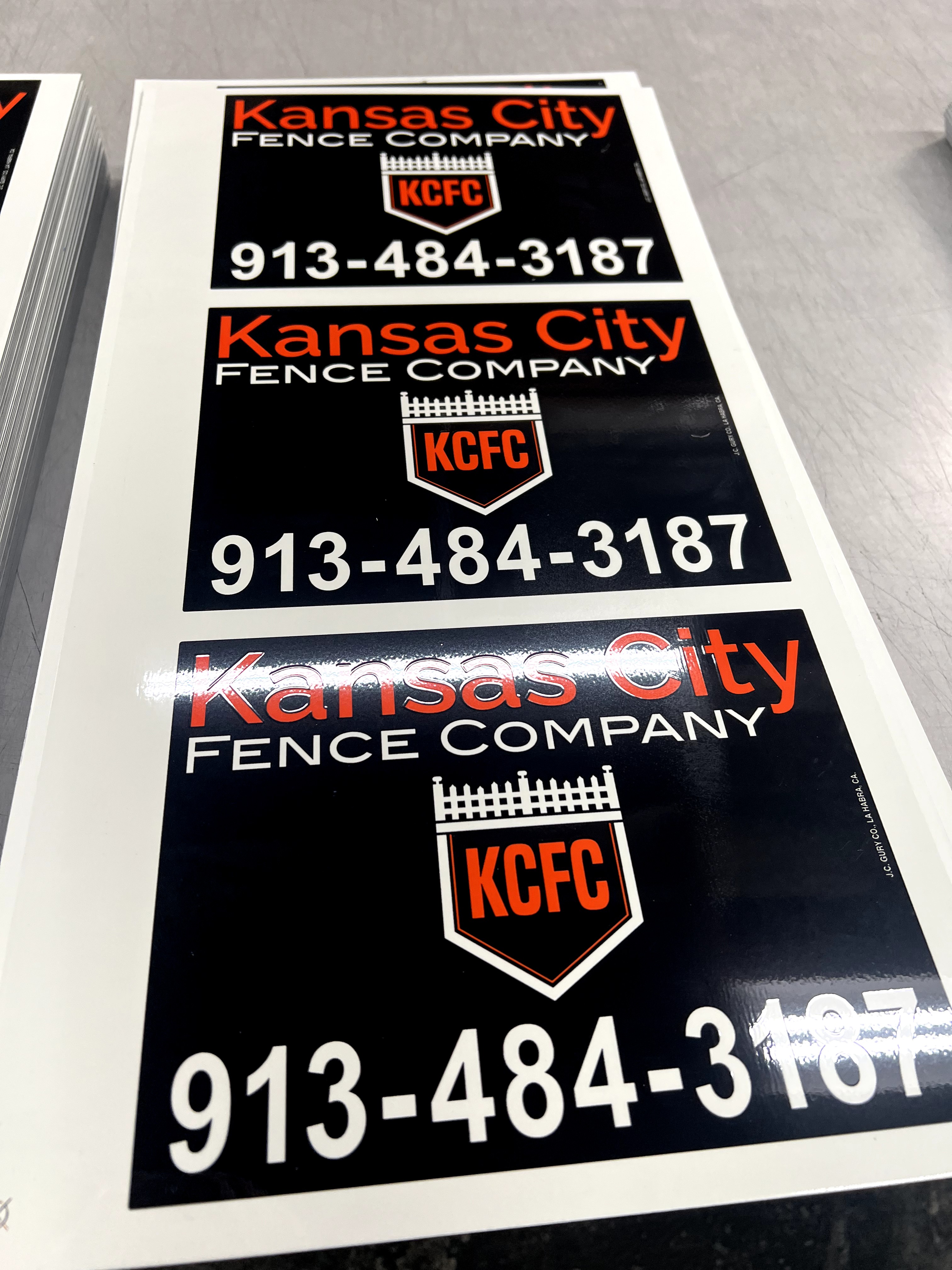 Custom black and red rectangle sign for fence businesses