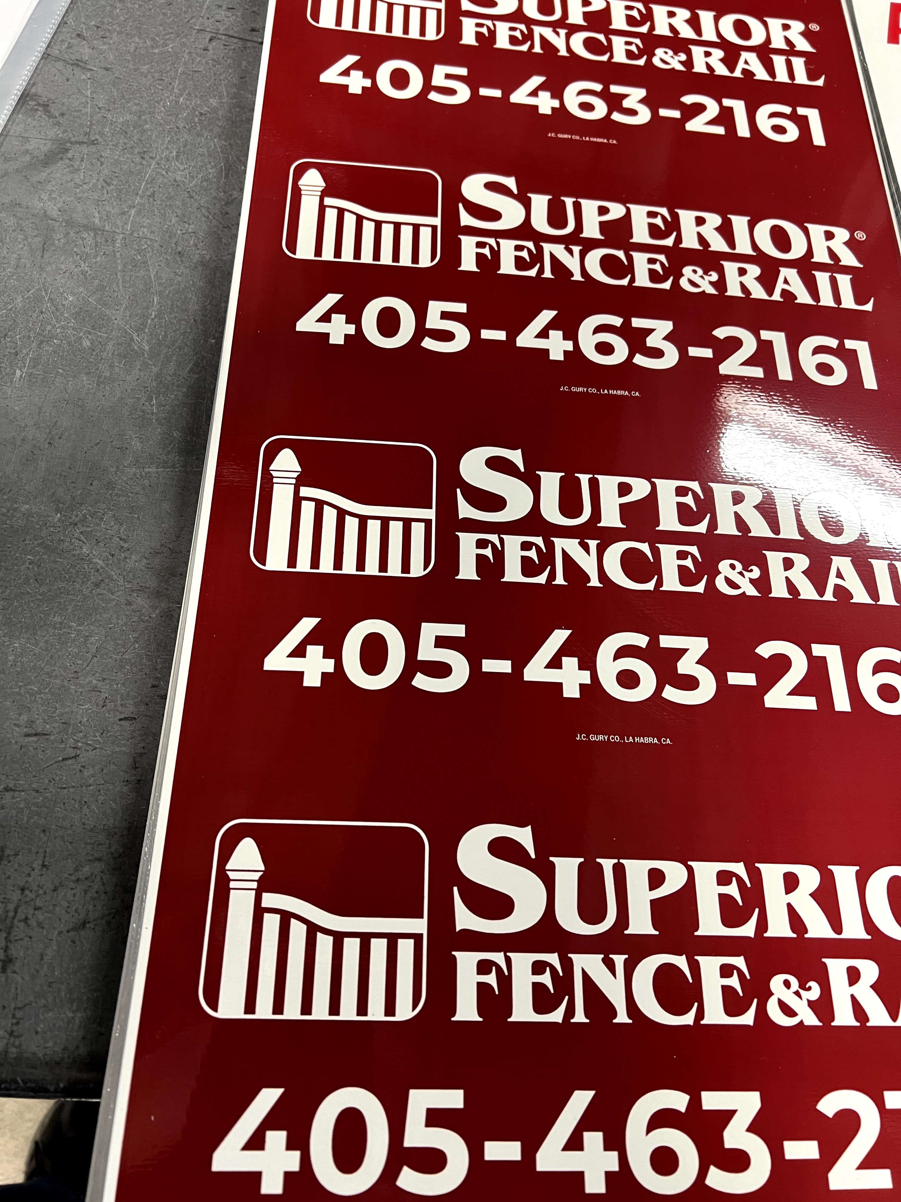 Custom red and white rectangle sign for fence businesses