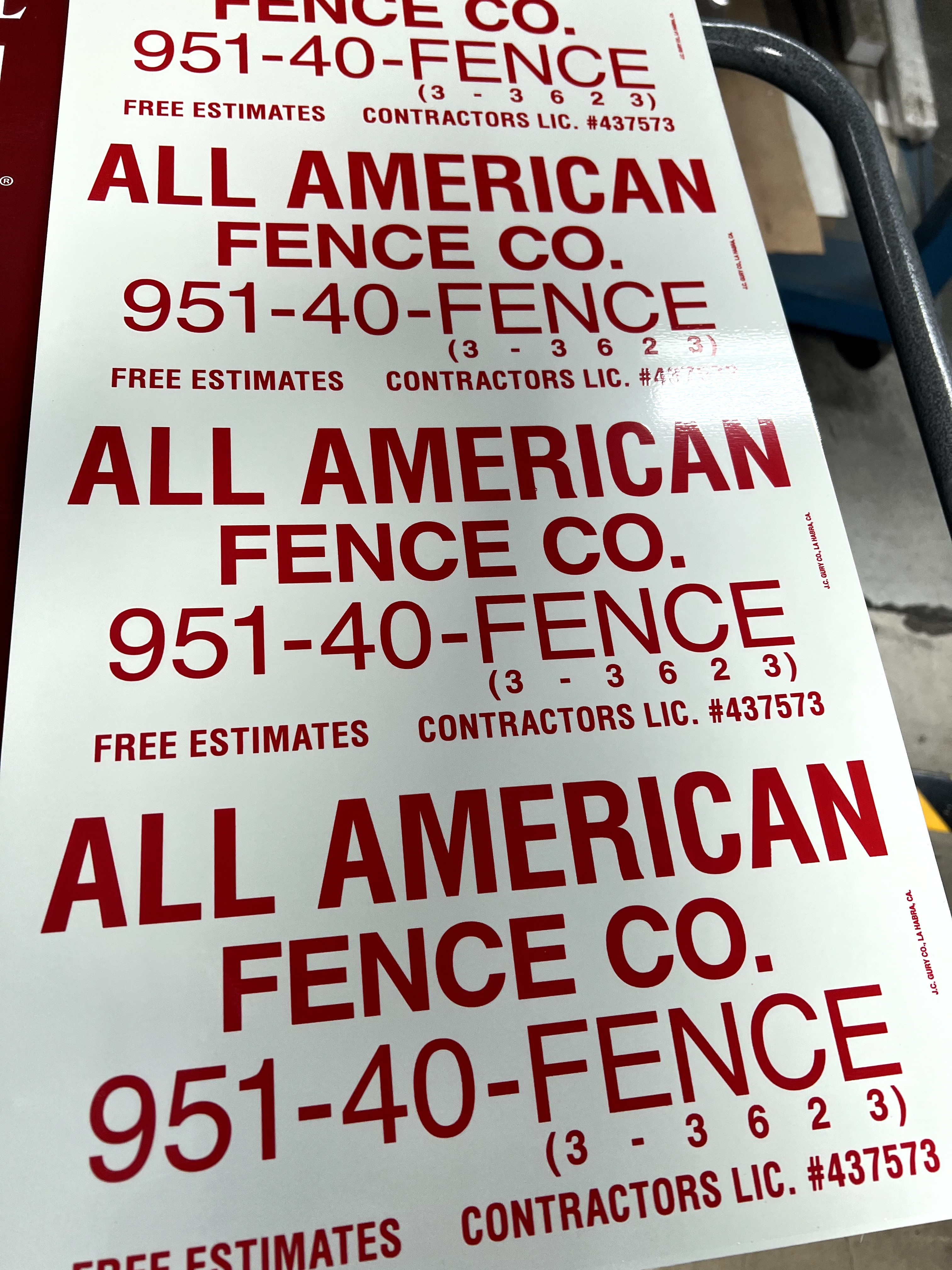 Custom red and white rectangle sign for fence businesses