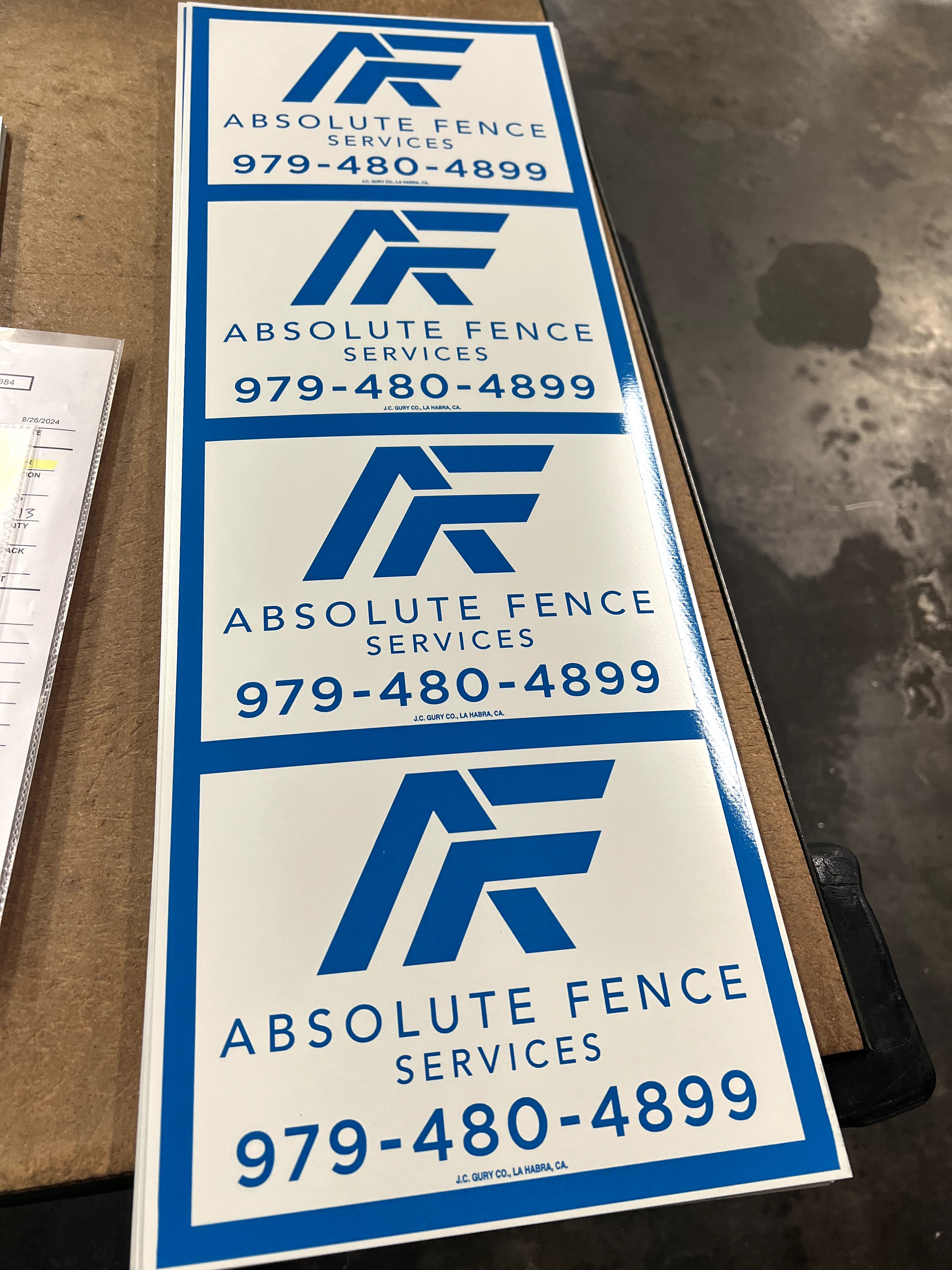 Custom blue and white rectangle sign for fence businesses