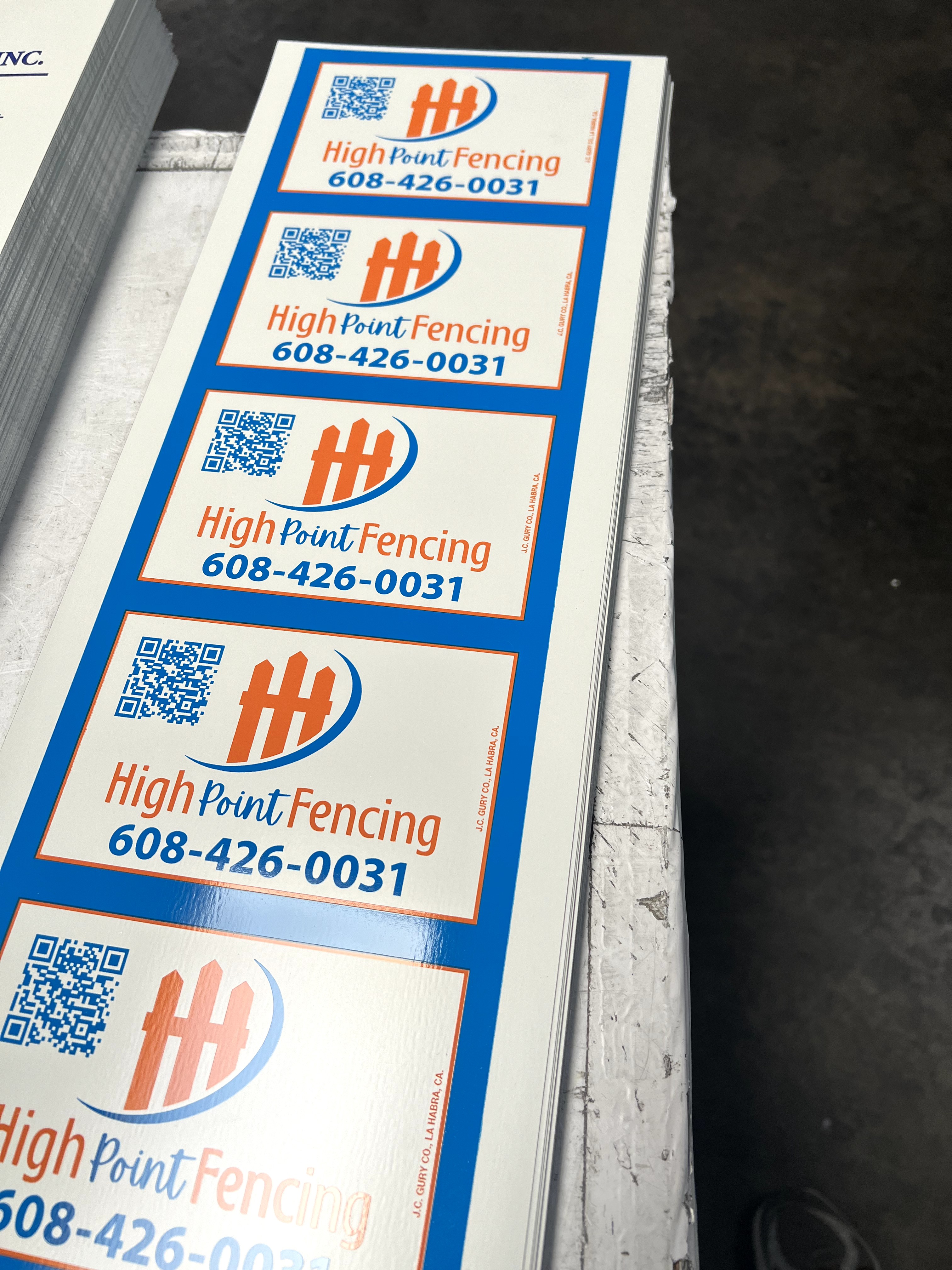 Custom blue and red rectangle sign for fence businesses