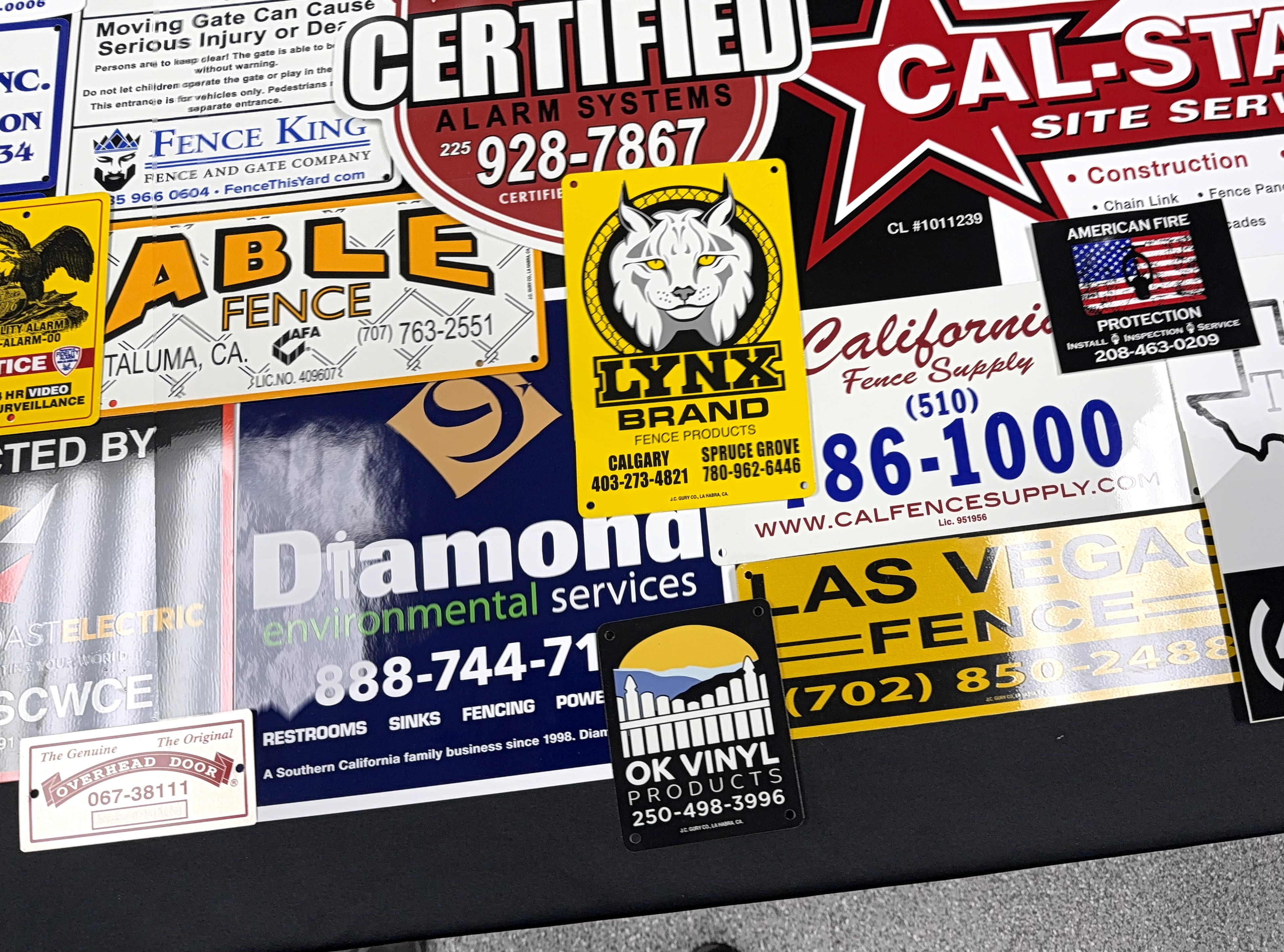 Custom blue and red rectangle sign for fence businesses