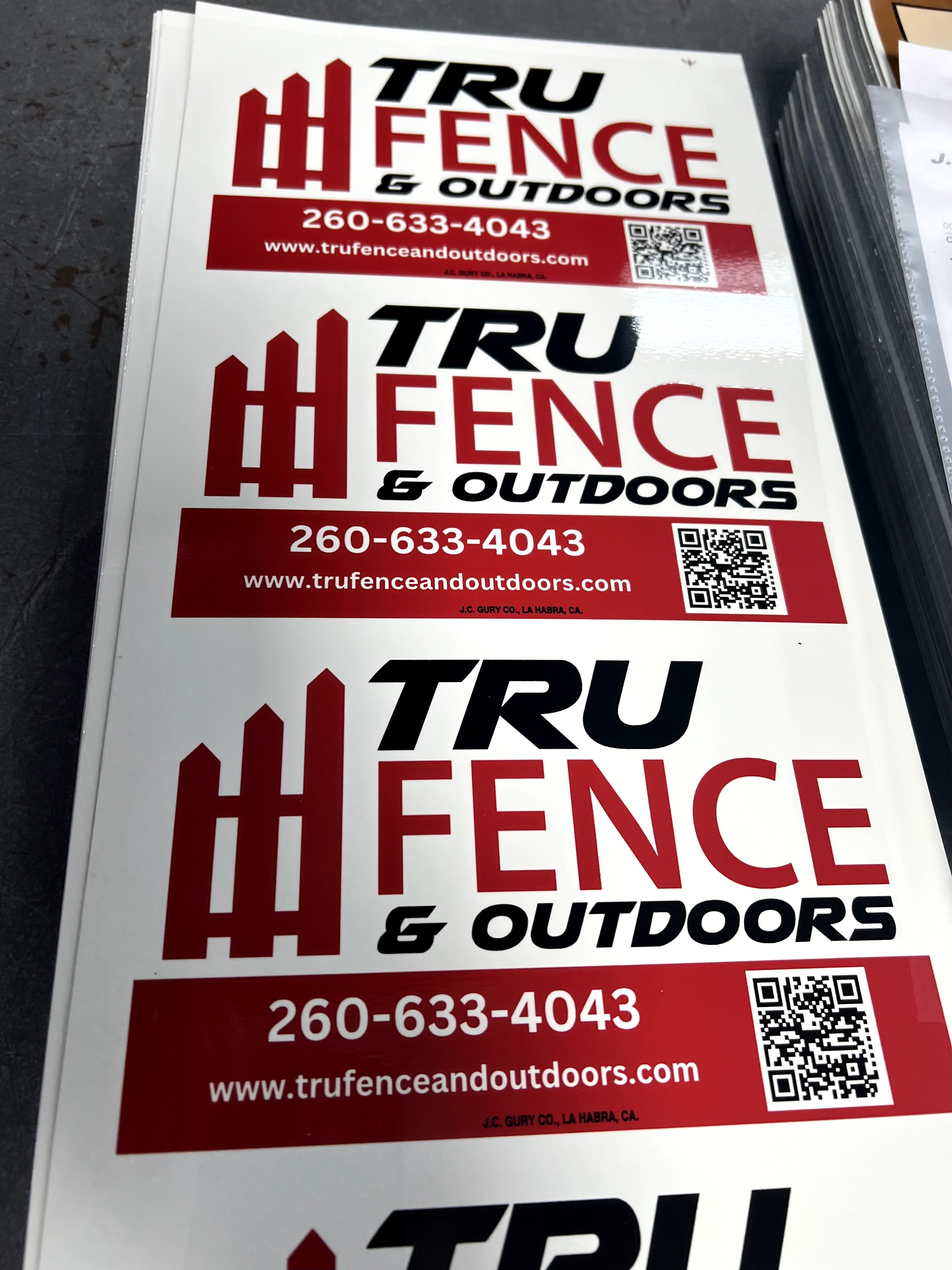 Custom cardinal-red and black rectangle sign for fence businesses