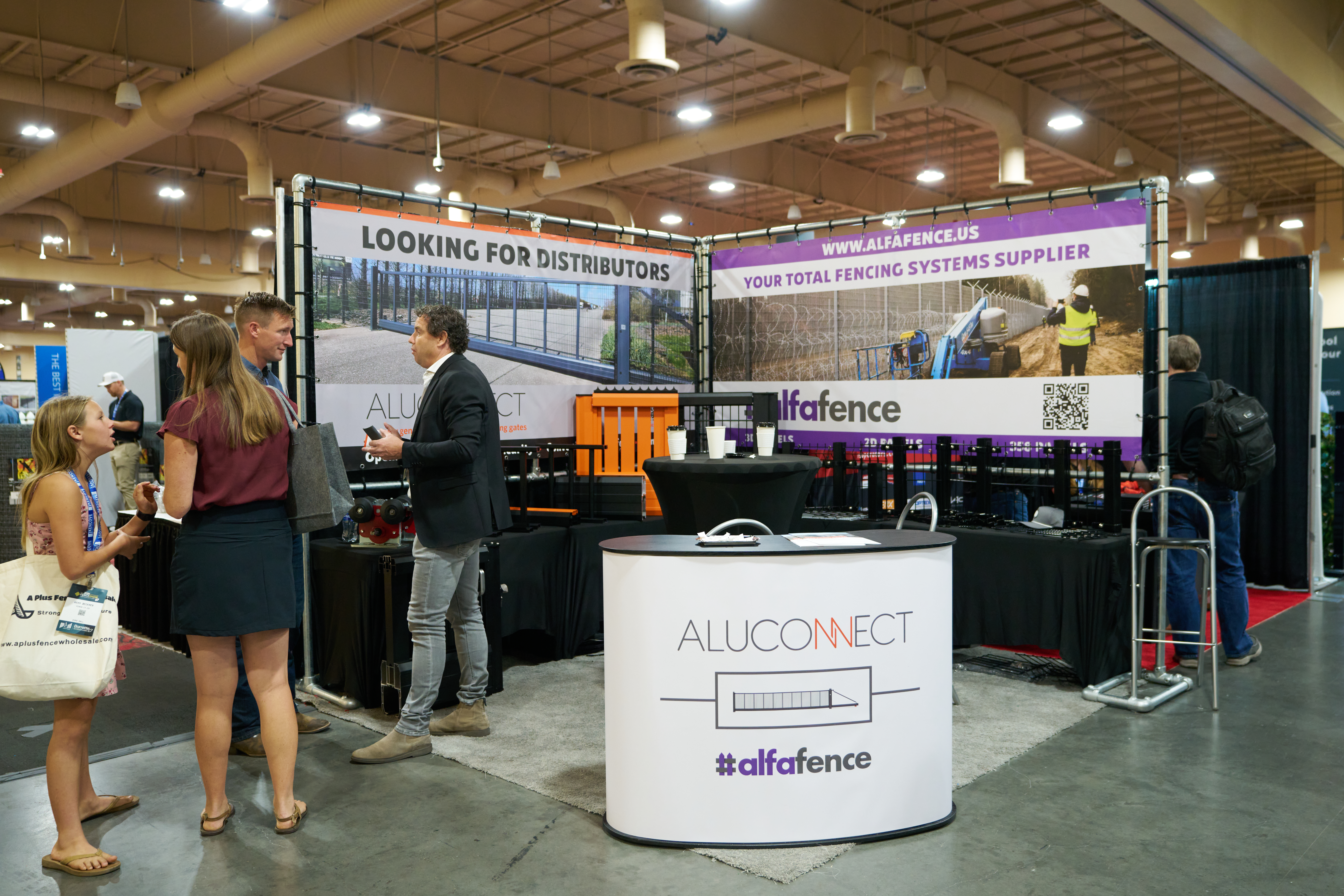 Aluconnect's trade booth showcasing high-quality fences, gates, and security solutions for total fencing systems.