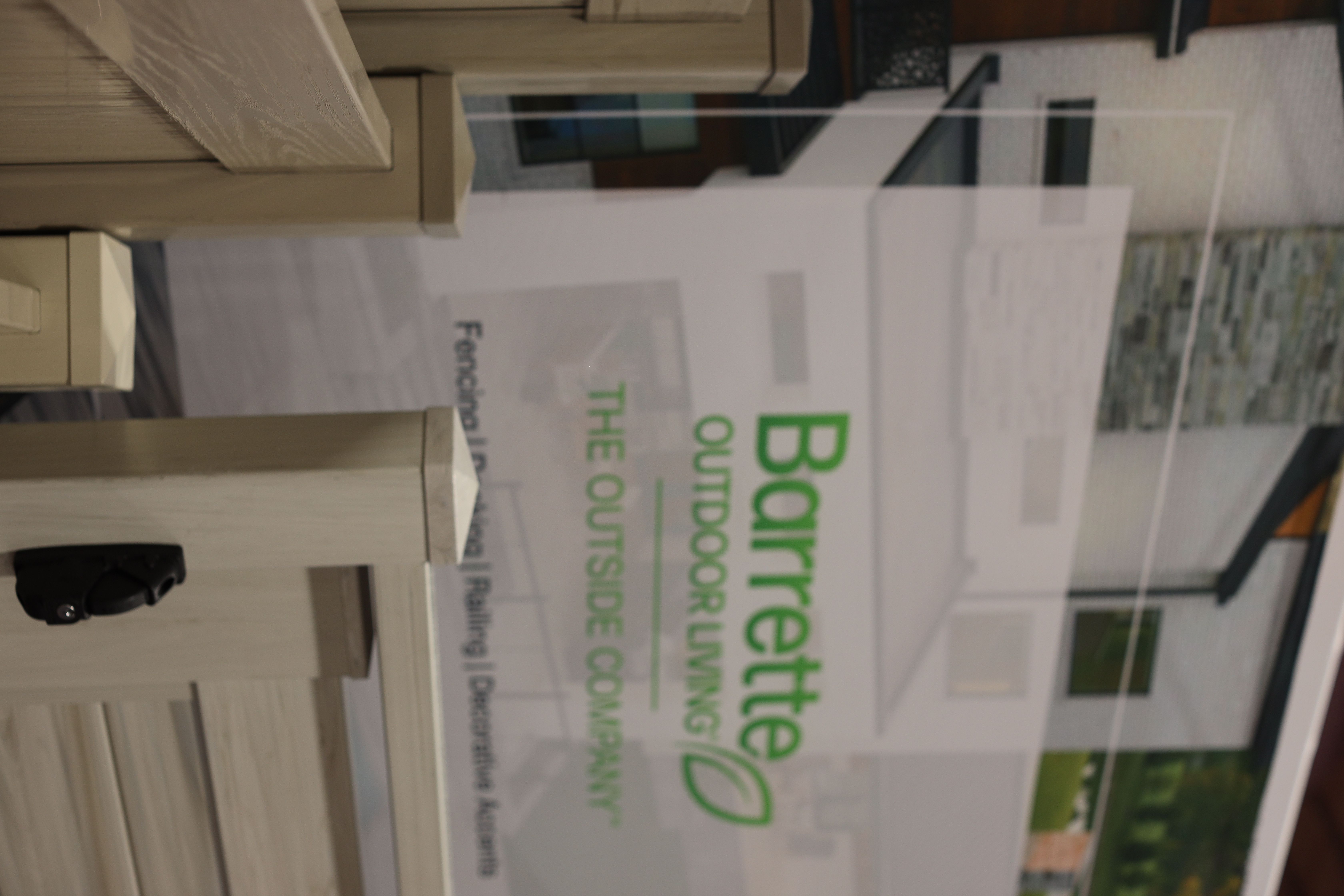 Barrette Outdoor Living trade show booth showcasing premium fencing, gates, and outdoor living products.