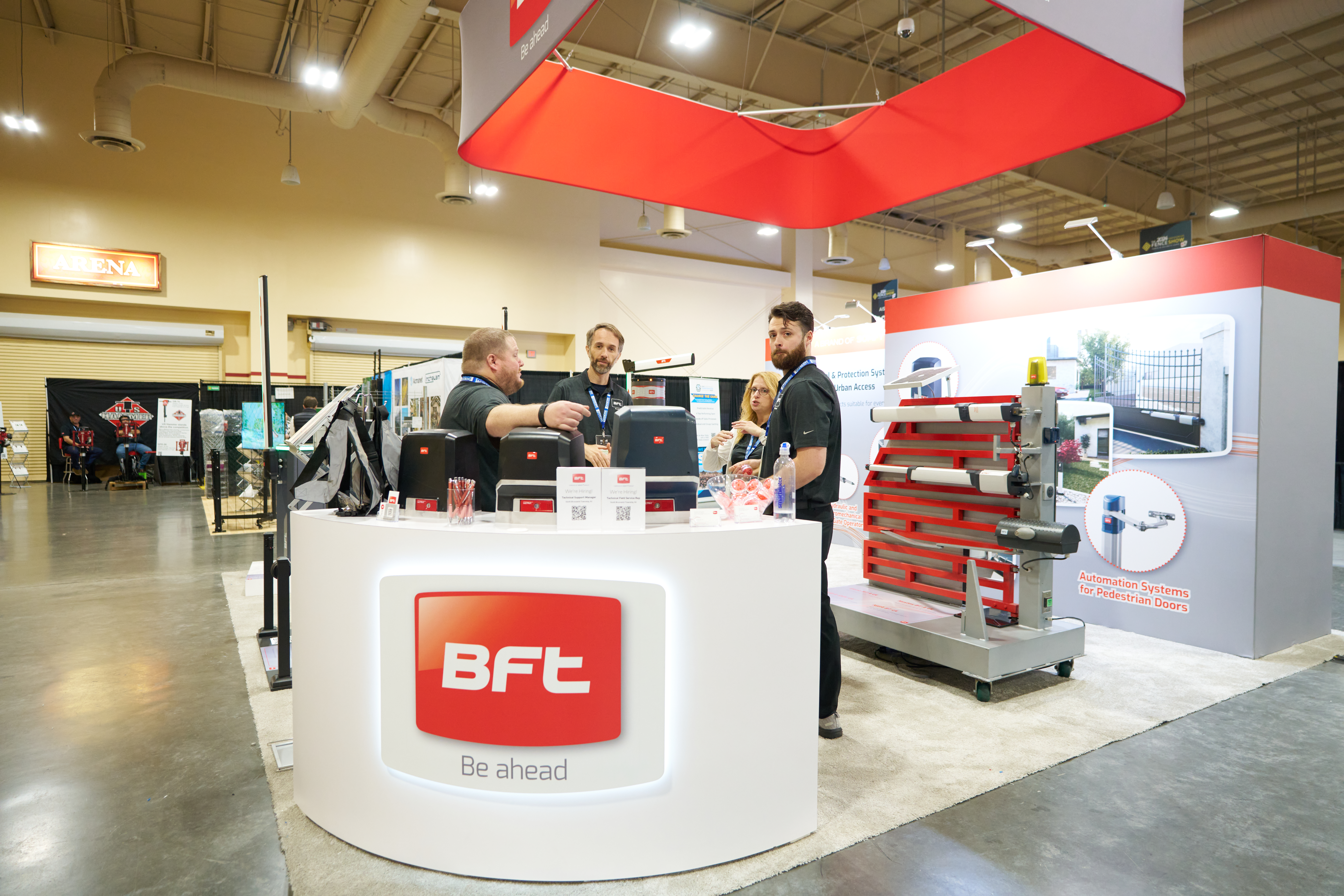 BFT Automation trade show booth showcasing advanced gate operators, barriers, and access control solutions for security.