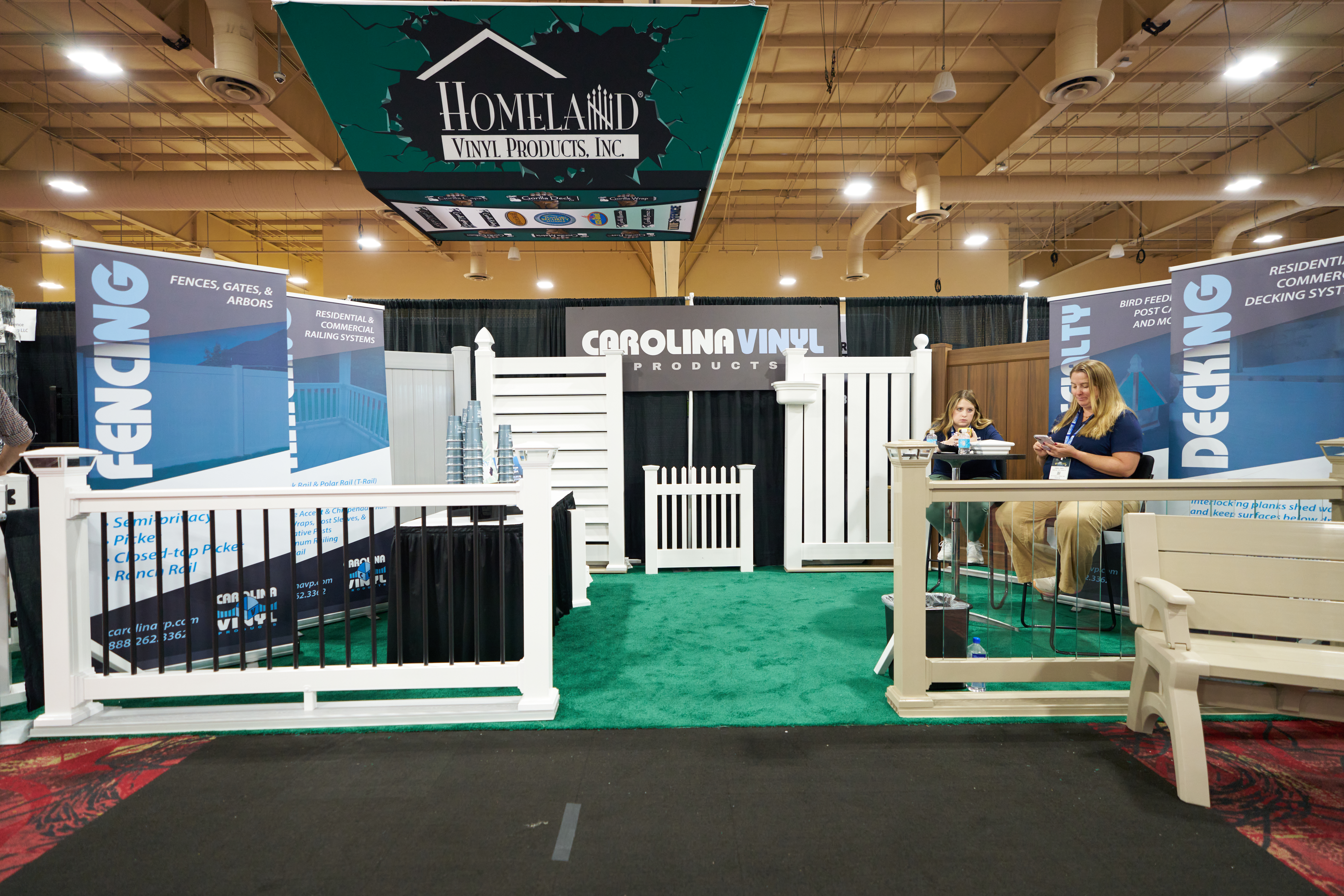 Carolina Vinyl Products, Inc. trade show display featuring vinyl and aluminum fencing, railings, and outdoor products.
