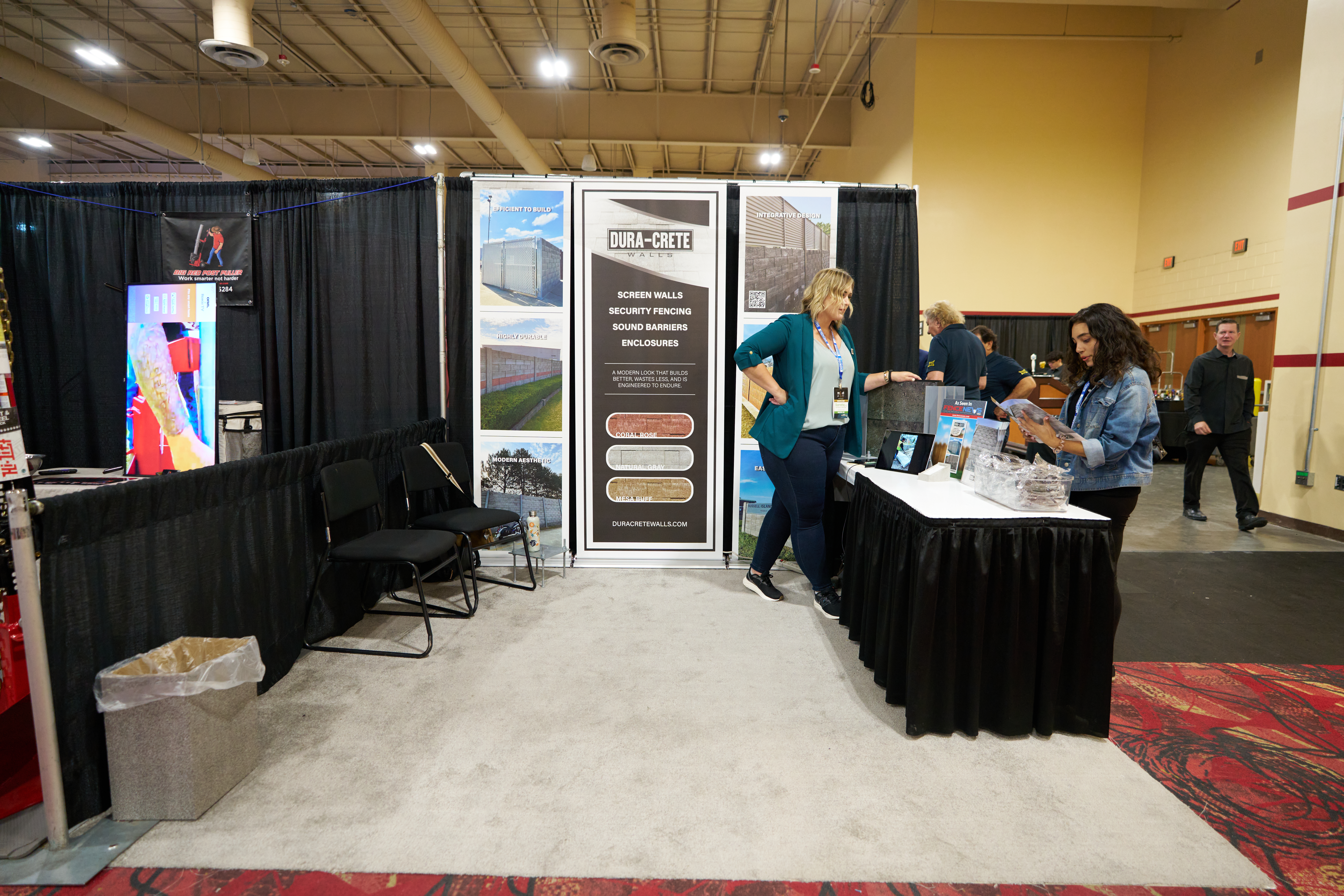 Dura-Crete Walls trade show booth showcasing precast concrete fences, sound barriers, and security solutions in action.