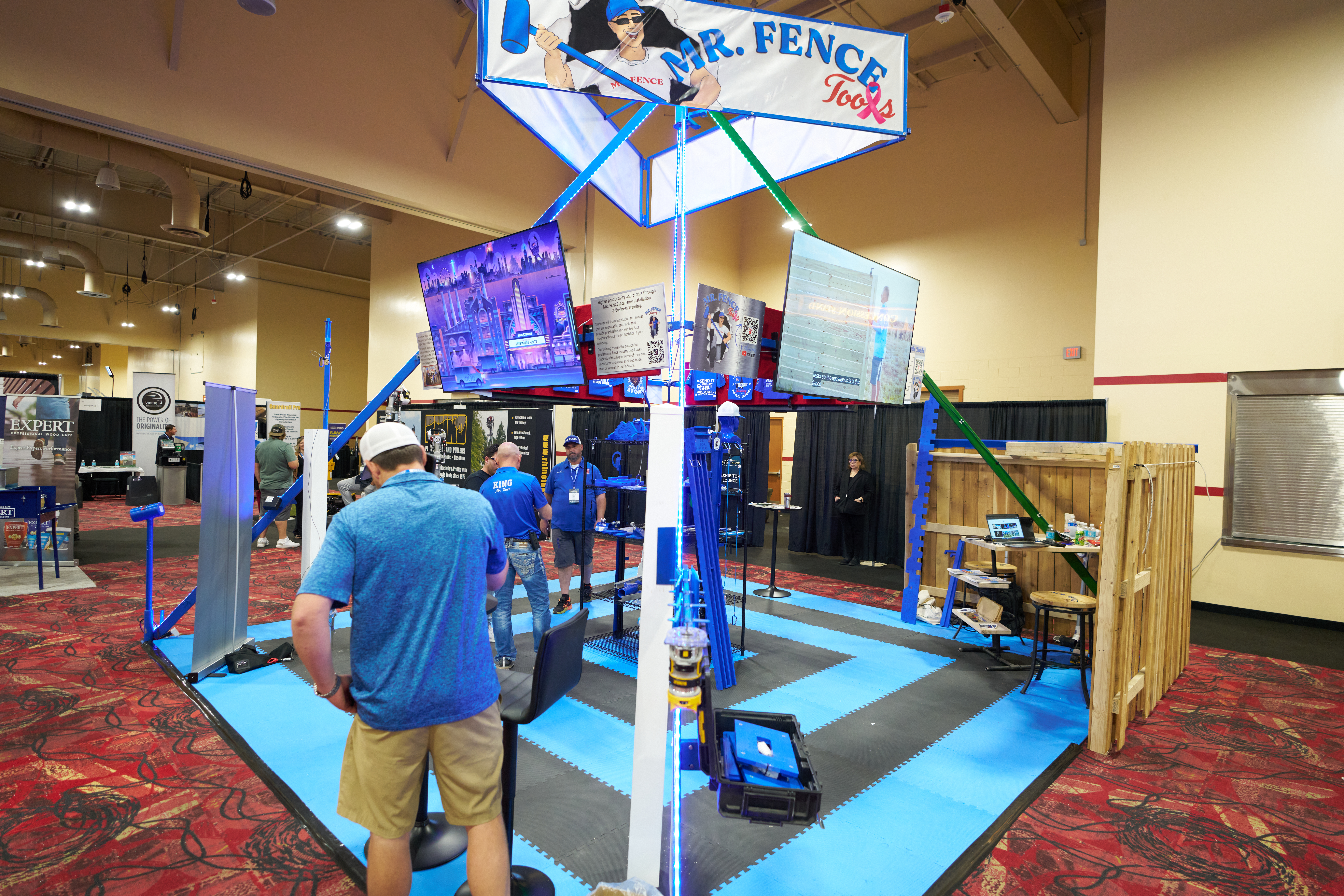 Mr. Fence Tools display showcasing professional-grade fence installation tools and products at a trade show booth.