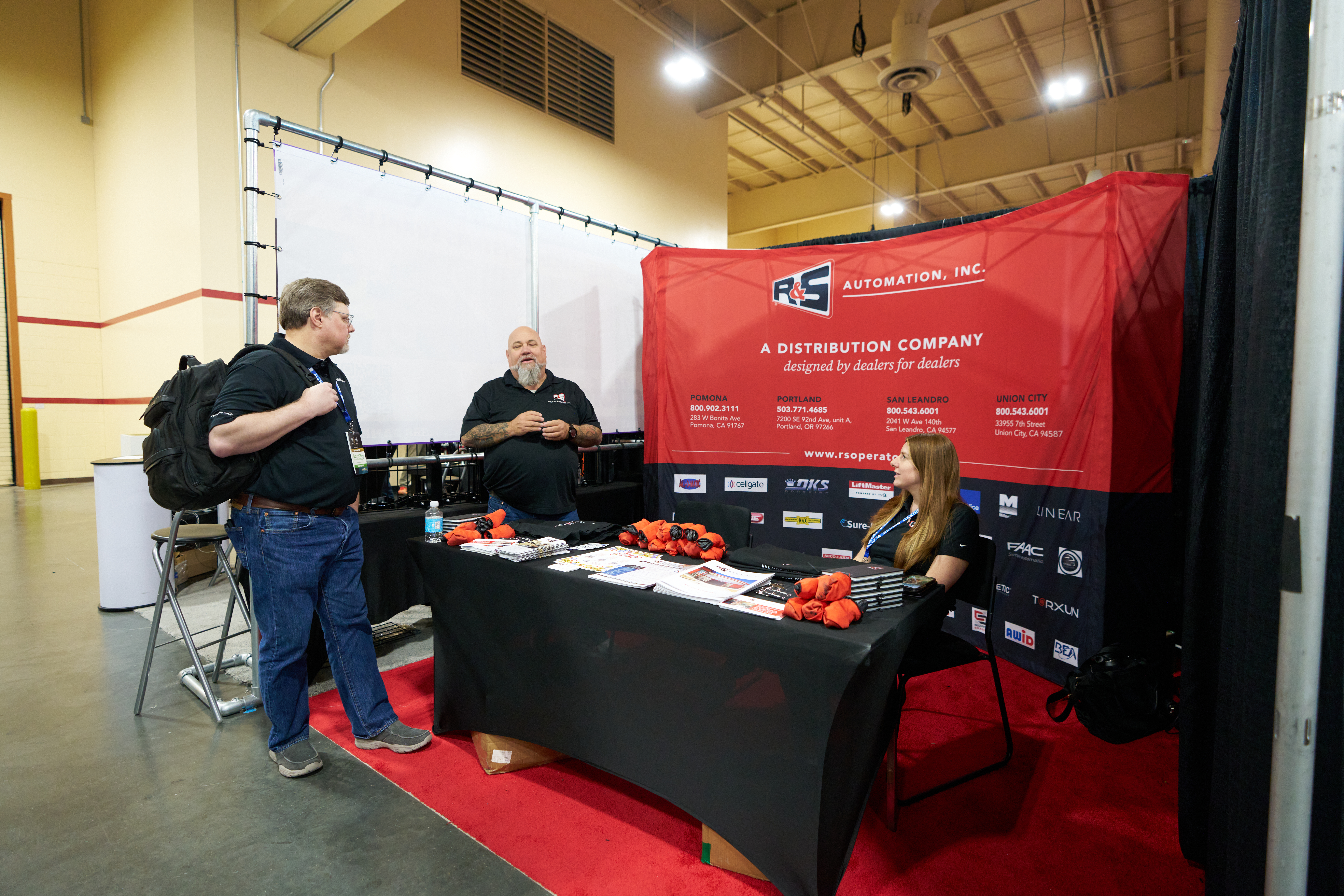 R&S Automation, Inc. trade show booth showcasing commercial gate operators and access control systems for security solutions.