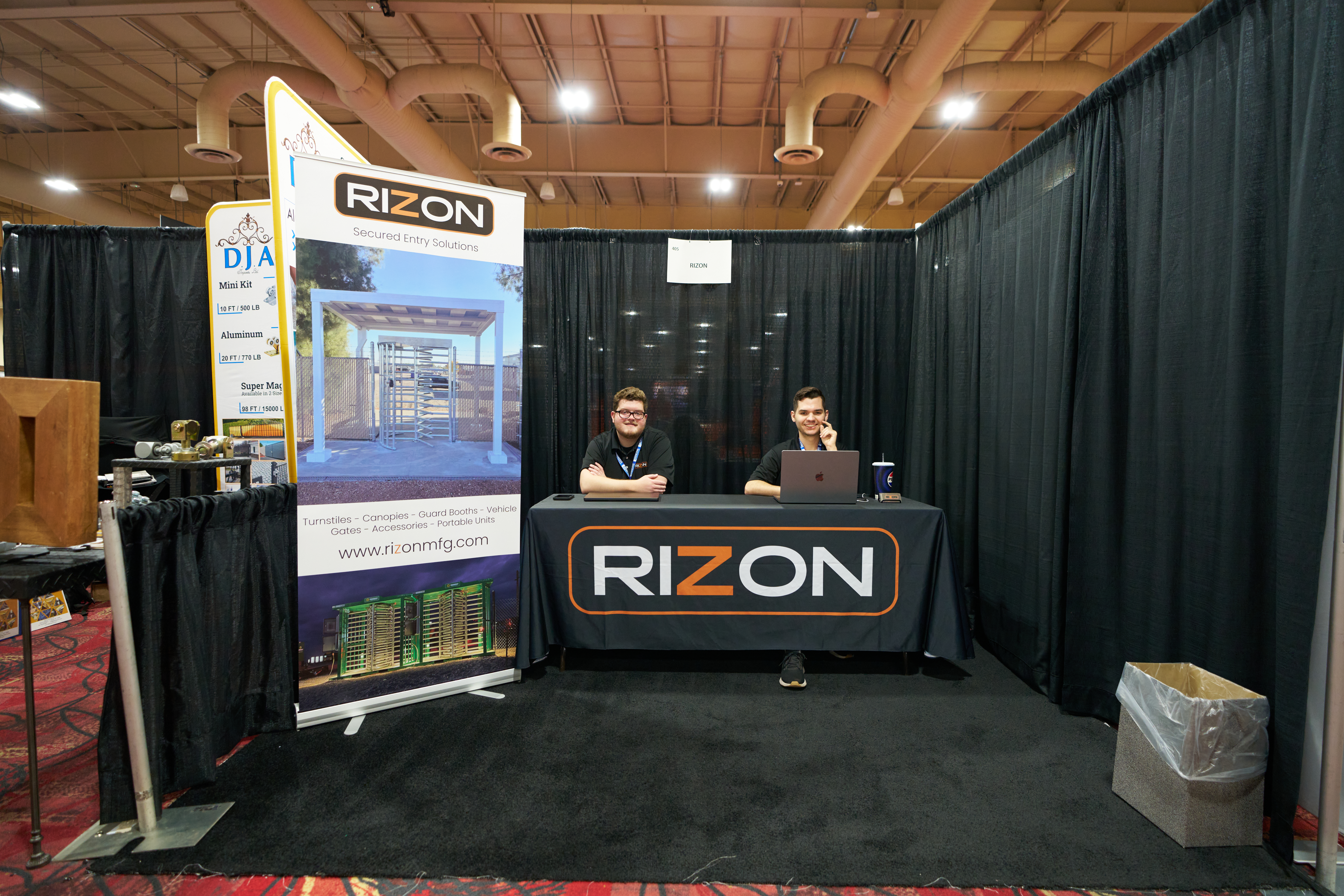 Rizon Manufacturing Inc. trade show booth showcasing turnstiles, security gates, and access control systems for enhanced safety.