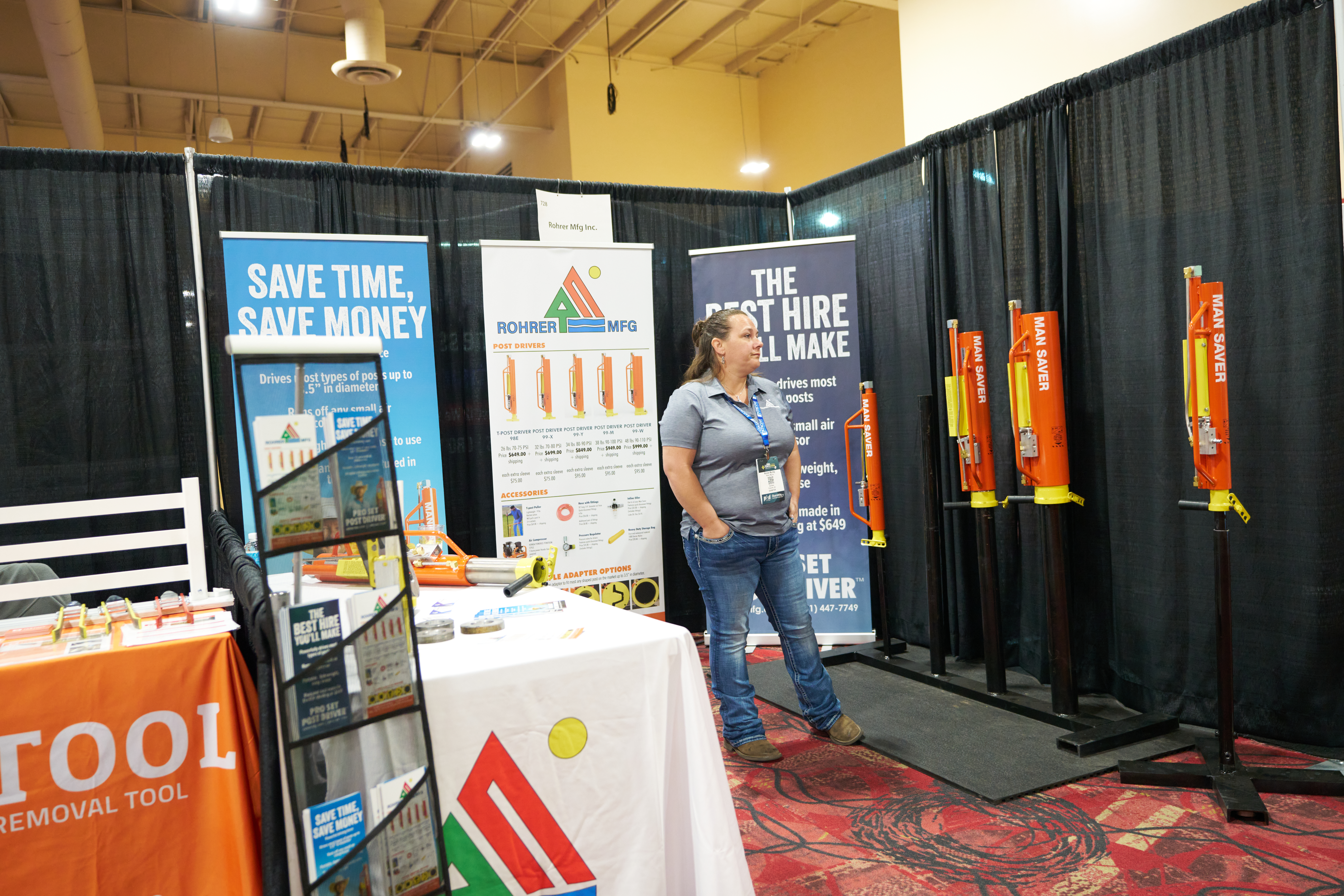 Rohrer Manufacturing Inc. trade show booth showcasing pneumatic post drivers and fence installation tools for efficient projects.