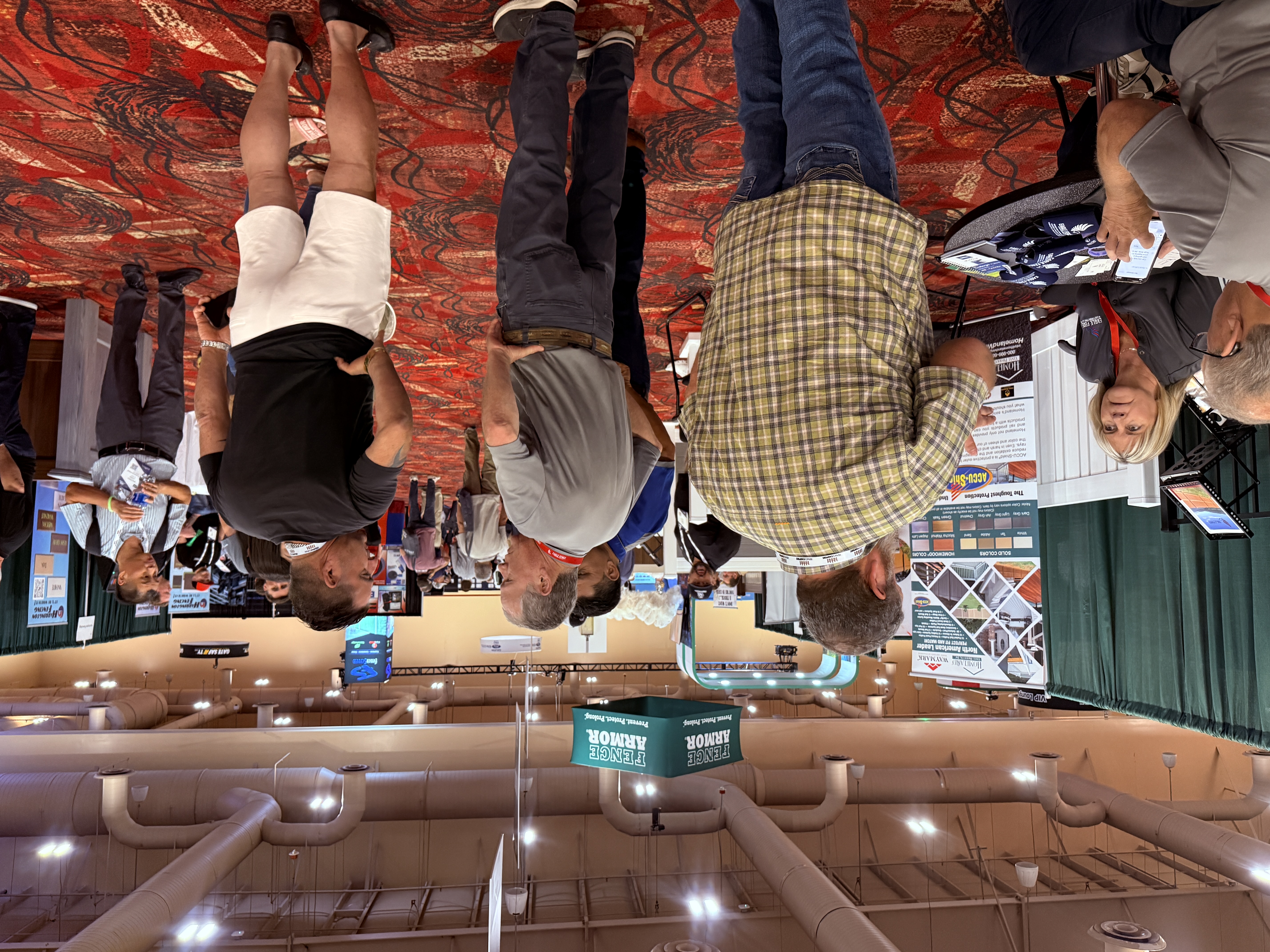 Fence Direct's trade booth showcasing vinyl, aluminum, wood, and chain-link fencing materials and professional installation services.